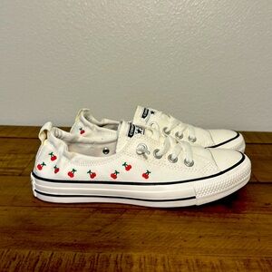 Brand new, size 7.5, low top, slip-on Converse with embroidered cherries.